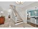Spacious foyer featuring marble floors, staircase, and custom molding, creating a welcoming ambiance at 575 Valley Hall Dr, Sandy Springs, GA 30350