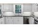 Bright kitchen with stainless steel appliances and white cabinets at 575 Valley Hall Dr, Sandy Springs, GA 30350