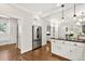 Bright kitchen with stainless steel appliances, white cabinets, and hardwood floors for a clean, modern aesthetic at 575 Valley Hall Dr, Sandy Springs, GA 30350