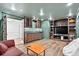 This entertainment room is complete with a bar, a TV, and recessed lighting at 575 Valley Hall Dr, Sandy Springs, GA 30350