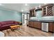 This stylish living room boasts a mini fridge, bar, and a cozy couch at 575 Valley Hall Dr, Sandy Springs, GA 30350