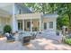 Charming covered patio with comfortable seating, ideal for relaxation and entertaining guests at 575 Valley Hall Dr, Sandy Springs, GA 30350