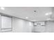 Finished basement with white walls, cabinets, and recessed lighting at 2142 Troutdale Dr, Decatur, GA 30032