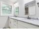Bathroom with a white double sink vanity and a large rectangular mirror at 2142 Troutdale Dr, Decatur, GA 30032
