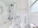 Bathroom featuring a shower and tub combo with marble tiling at 2142 Troutdale Dr, Decatur, GA 30032