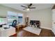 Bedroom with hardwood floors, a ceiling fan, large window and a desk area at 2142 Troutdale Dr, Decatur, GA 30032