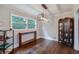 Dining area featuring hardwood floors, modern light fixture, and large window with backyard view at 2142 Troutdale Dr, Decatur, GA 30032