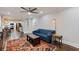Open-concept living room featuring hardwood floors, ceiling fan, and access to the dining area at 2142 Troutdale Dr, Decatur, GA 30032