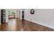 Hardwood floors gleam in this living room space with view of the adjacent room at 2142 Troutdale Dr, Decatur, GA 30032