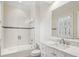 Bright bathroom featuring a tub with shower, a vanity with a marble countertop, and tile flooring at 2671 Bohler Nw Rd, Atlanta, GA 30327