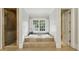 Bright bathroom featuring a soaking tub with a window, and a glass-enclosed shower at 2671 Bohler Nw Rd, Atlanta, GA 30327