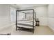 Serene bedroom featuring a four poster bed frame, neutral decor, and plantation shutters at 2671 Bohler Nw Rd, Atlanta, GA 30327