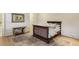 Cozy bedroom showcasing hardwood floors, neutral decor and a classic bed frame with stylish bedding at 2671 Bohler Nw Rd, Atlanta, GA 30327