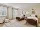 Bright bedroom with two beds, hardwood floors, soft lighting, and cozy decor at 2671 Bohler Nw Rd, Atlanta, GA 30327