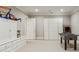This bright bonus room features built-ins, a foosball table, and ample space for fun and games at 2671 Bohler Nw Rd, Atlanta, GA 30327