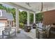 Spacious covered porch with comfortable seating and a swing, perfect for outdoor entertaining at 2671 Bohler Nw Rd, Atlanta, GA 30327