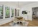Cozy breakfast nook featuring large windows and a stylish chandelier at 2671 Bohler Nw Rd, Atlanta, GA 30327