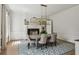 Formal dining room with fireplace, stylish chandelier, and large windows at 2671 Bohler Nw Rd, Atlanta, GA 30327