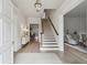 Bright and airy foyer with hardwood floors and a classic staircase at 2671 Bohler Nw Rd, Atlanta, GA 30327