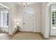 Elegant foyer with detailed molding, arched window over door, and neutral decor at 2671 Bohler Nw Rd, Atlanta, GA 30327
