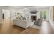 Bright living room boasts hardwood floors, fireplace, coffered ceilings, and french doors to the backyard at 2671 Bohler Nw Rd, Atlanta, GA 30327