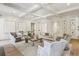 Open living room design features hardwood floors, neutral paint colors, and coffered ceiling at 2671 Bohler Nw Rd, Atlanta, GA 30327