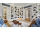 Spacious living room with built-in bookshelves, comfortable seating, and hardwood floors at 2671 Bohler Nw Rd, Atlanta, GA 30327