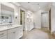 Open bathroom featuring white cabinets, dual sinks and a doorway to other rooms at 2671 Bohler Nw Rd, Atlanta, GA 30327