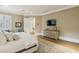 Relaxing main bedroom featuring a dresser, lounge, hardwood flooring and natural light at 2671 Bohler Nw Rd, Atlanta, GA 30327
