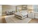 Cozy main bedroom with a king-size bed, two chairs, and hardwood floors at 2671 Bohler Nw Rd, Atlanta, GA 30327