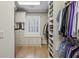 Custom walk-in closet with built-in storage, window seat and hardwood flooring, providing plenty of space for storage at 2671 Bohler Nw Rd, Atlanta, GA 30327