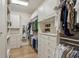 Spacious walk-in closet with custom shelving, drawers, and ample hanging space for clothing and accessories at 2671 Bohler Nw Rd, Atlanta, GA 30327