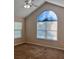 Spacious bedroom with vaulted ceiling and large arched window offering natural light at 302 Gladstone Dr, Mcdonough, GA 30253