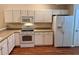 Bright kitchen featuring ample cabinet space and modern appliances at 302 Gladstone Dr, Mcdonough, GA 30253