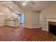 Open concept living area featuring a fireplace and views into the kitchen with breakfast bar at 302 Gladstone Dr, Mcdonough, GA 30253