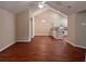 Open concept living and dining area featuring a vaulted ceiling and laminate flooring at 302 Gladstone Dr, Mcdonough, GA 30253