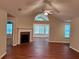 Bright living area featuring a fireplace, vaulted ceiling, and large windows at 302 Gladstone Dr, Mcdonough, GA 30253