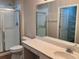 Bathroom showcasing a glass-enclosed shower and a vanity with a white countertop at 302 Gladstone Dr, Mcdonough, GA 30253