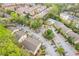 Aerial view of the complex with swimming pool, mature trees, car park and multiple apartment buildings at 3160 Seven Pines Unit 105 Ct, Atlanta, GA 30339