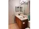 Bathroom with vanity sink, toilet, large mirror, and tile flooring at 3160 Seven Pines Unit 105 Ct, Atlanta, GA 30339