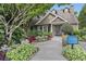 Beautiful clubhouse featuring manicured landscaping and a welcoming entrance at 3160 Seven Pines Unit 105 Ct, Atlanta, GA 30339