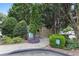 Dog park area with a pet waste station and surrounding lush landscaping at 3160 Seven Pines Unit 105 Ct, Atlanta, GA 30339