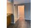 Hallway featuring hardwood floors, neutral paint and access to living spaces and bedrooms at 3160 Seven Pines Unit 105 Ct, Atlanta, GA 30339