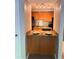 Kitchen featuring wooden breakfast bar with granite counters, light fixtures and stainless steel appliances at 3160 Seven Pines Unit 105 Ct, Atlanta, GA 30339