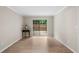 Bright living room with hardwood floors and sliding glass doors to the backyard at 3160 Seven Pines Unit 105 Ct, Atlanta, GA 30339