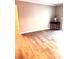 Bright and airy living room featuring hardwood floors and neutral walls with an interior design table at 3160 Seven Pines Unit 105 Ct, Atlanta, GA 30339