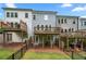 Townhome backyard with three patios and a fenced in yard space at 402 Retreat Ln, Canton, GA 30114