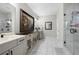 Bright bathroom with dual vanities, glass shower, and tile flooring at 402 Retreat Ln, Canton, GA 30114