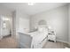 Comfortable bedroom with a twin bed, lots of light, and an ensuite bathroom at 402 Retreat Ln, Canton, GA 30114