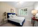 Charming bedroom featuring a plush bed with decorative wallpaper and ample natural light at 402 Retreat Ln, Canton, GA 30114